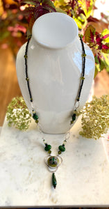 Green necklace with pewter and "Gems"